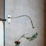 Gold metal wall sconce warm LED light close-up