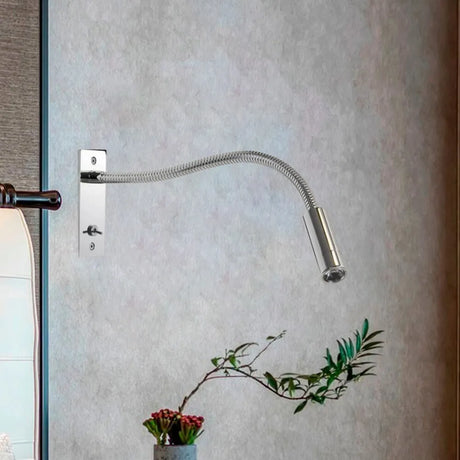 Gold metal wall sconce warm LED light close-up
