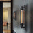 Black Cylinder Wall Lamp Mounted on Wall Setting