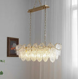 The linear version lit on a flat bar in a room with sheer curtains and a frame