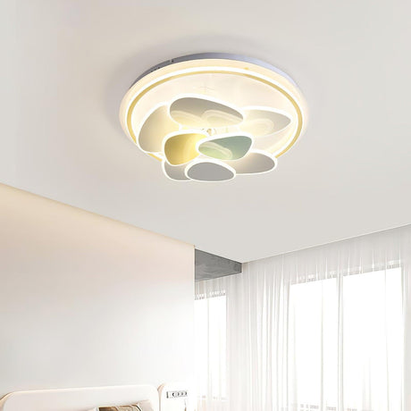 Layered cloud ceiling light lit in a pale bedroom with a sheer curtain