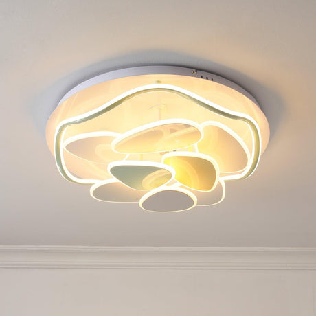 Cloud motif ceiling light lit warm against a white ceiling