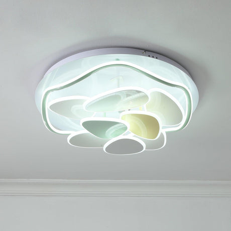 Cloud motif ceiling light lit cool against a pale ceiling