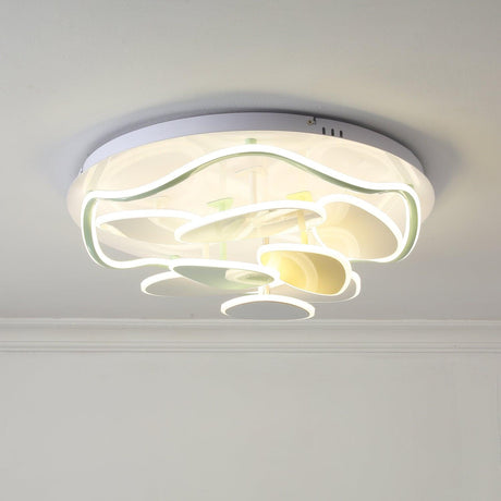 Cloud motif ceiling light seen at an angle near a cornice