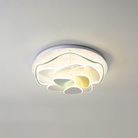 Cloud motif ceiling light seen at an angle, lit, against a plain ceiling