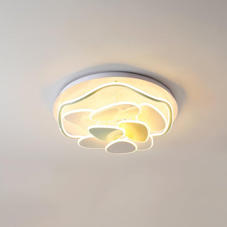 Cloud motif ceiling light lit close up with the yellow and green shapes