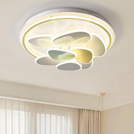 Cloud motif ceiling light seen close up under a plain white ceiling