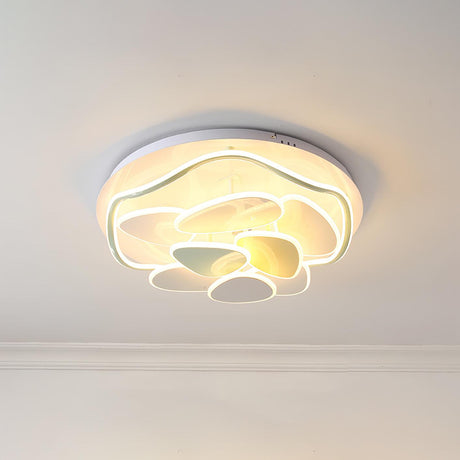 Cloud motif ceiling light lit, seen from below against a white ceiling