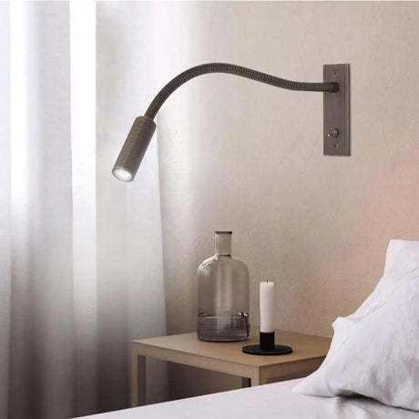 Gold wall sconce warm ambient glow bedroom scene