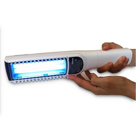 Portable UVB phototherapy device in use