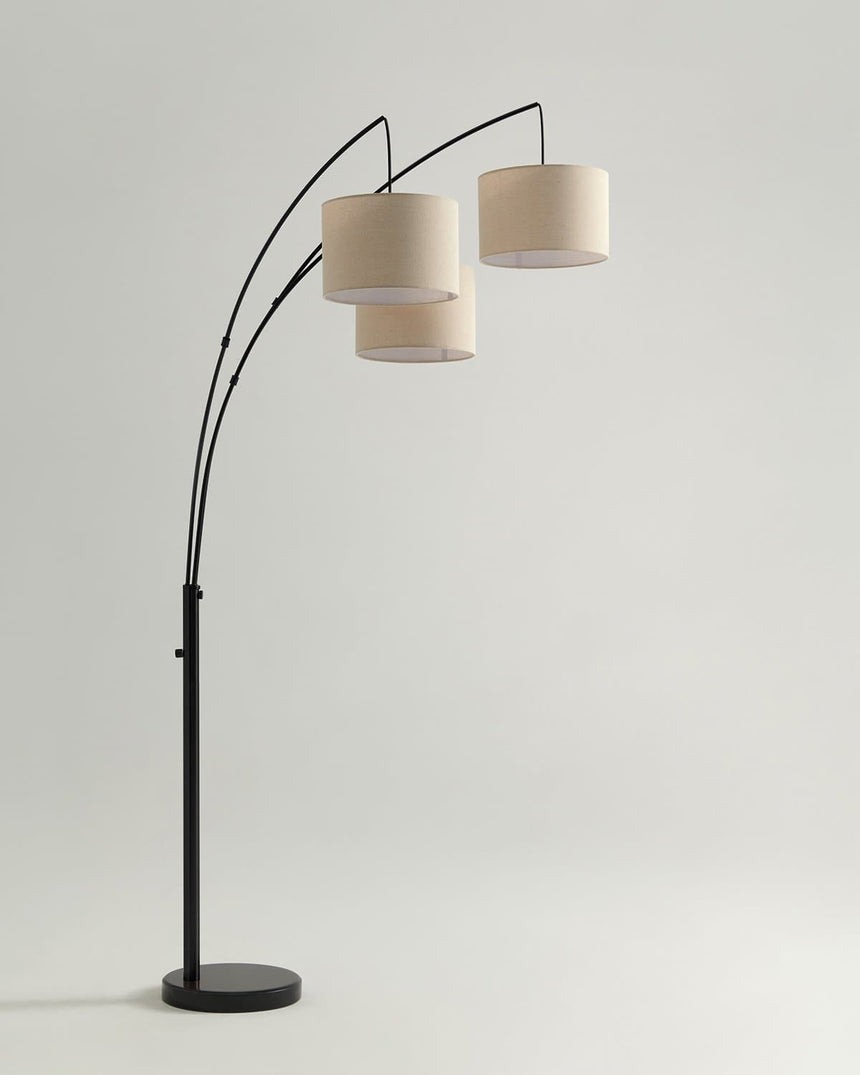 The black version of the three arm lamp with the shades staggered in depth