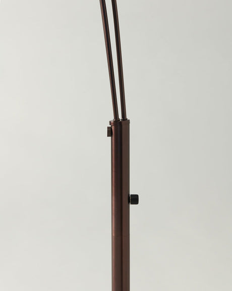 The switch collar on the bronze pole where the three arms leave the stem