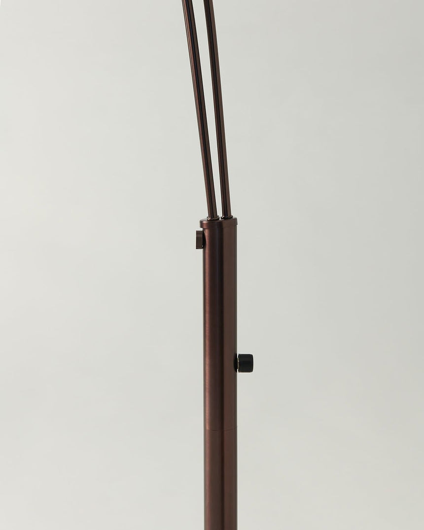 The switch collar on the bronze pole where the three arms leave the stem
