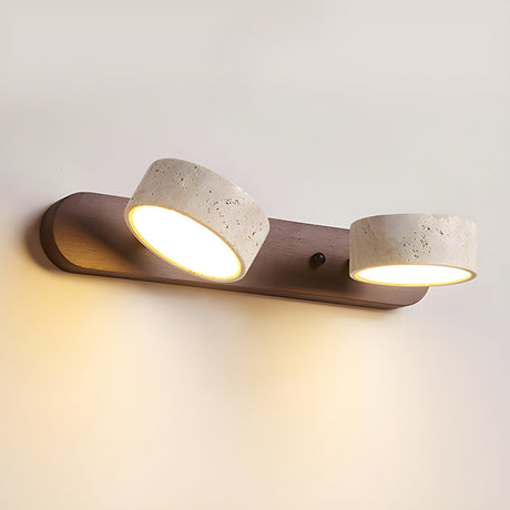 The three light version lit, warm pools of light under each stone disc