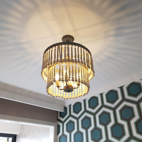 Seen from below, the lit tiers throwing a pattern across the ceiling