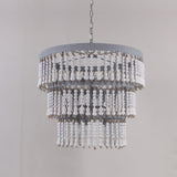 The fitting unlit against a gray wall, showing the drum rim and bead tiers