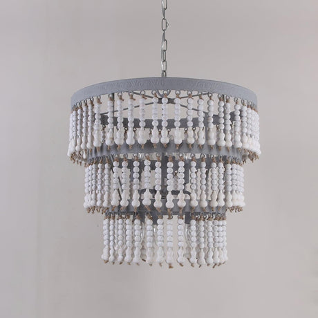 The fitting unlit against a gray wall, showing the drum rim and bead tiers