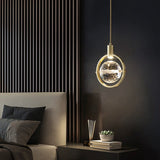 Crystal and metal pendant light fixture detail
