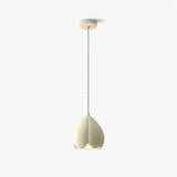 Glass pendant lamp installed above dining table