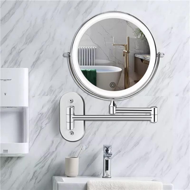 Chrome LED magnifying vanity mirror wall mounted in bathroom