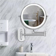 Chrome LED magnifying vanity mirror wall mounted in bathroom