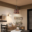 Metal pendant light with sculptural bucket silhouette