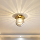 Gold glass LED ceiling light with sleek modern silhouette