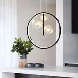 Solera pendant light suspended above dining island