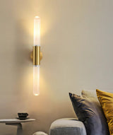 Wall lamp illuminated in bedroom setting
