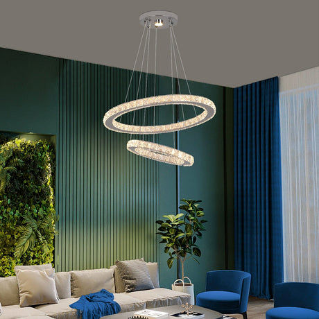 crystal chandelier lit in dining room setting