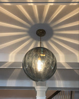 Bubble Glass Pendant Light Illuminated with Warm Ambient Glow | OroDwell