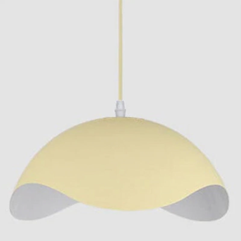 Black Pendant Light Installed Above Dining Table