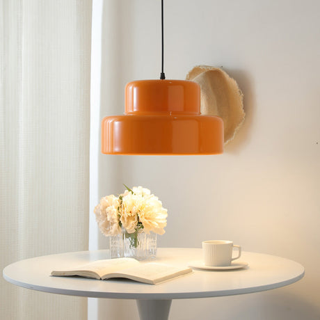 Orange pendant light illuminated above kitchen island