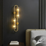 Hallway wall light with brass tubes
