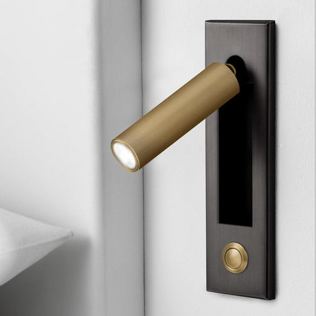 Wall sconce illuminating reading corner