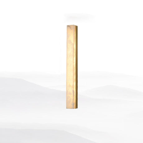 Lyra brass alabaster wall lamp styled bedroom setting