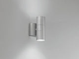 Twin head wall lamp shown at night