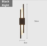 Black wall lamp warm ambient glow view