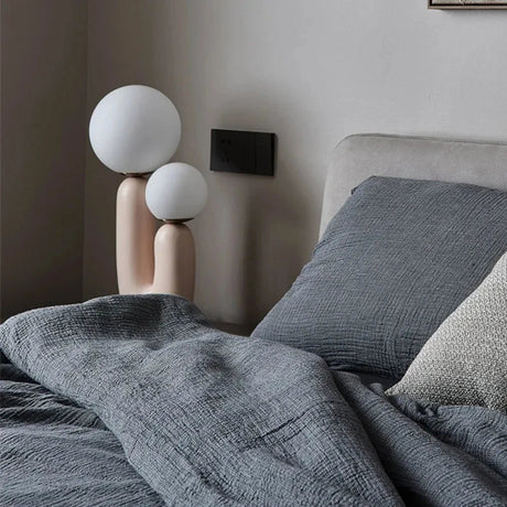 Table lamp with button switch for simple operation
