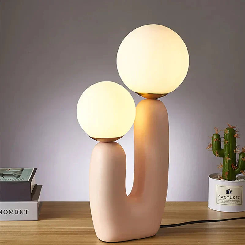Resin and metal table lamp with warm LED ambient glow