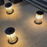 Lantern light placed along a garden wall