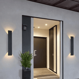 Outdoor wall lamp shown at dusk