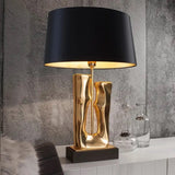 Trunk table lamp with golden lining and marble inspired detailing