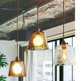 Glass pendant lamp iron finish close-up detail