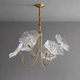 Glass chandelier installed above kitchen island