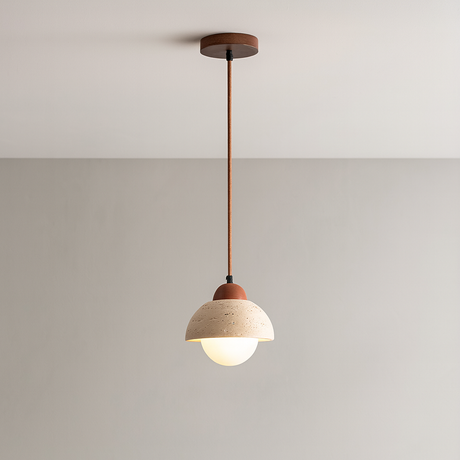 Stone and iron pendant light illuminated ambient glow