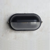 Industrial style wall light for backyard spaces