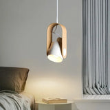 Metal pendant lamp illuminated above dining table