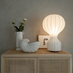 Modern table lamp with silk shade and soft warm light