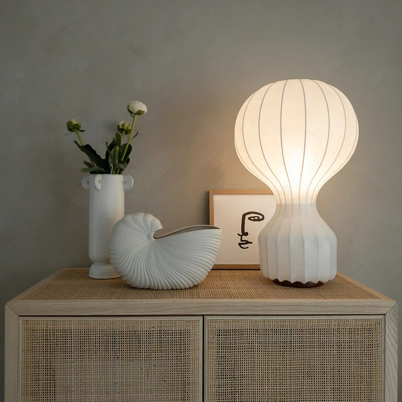 Modern table lamp with silk shade and soft warm light
